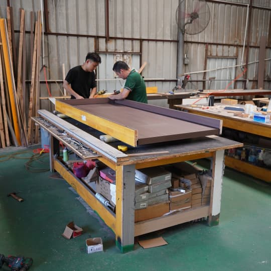 workers assembling interior door leaf
